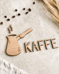 Dekorativ Jazwha-kaffekande med teksten KAFFE i egefinér, valnødsfinér eller spejlakryl til væggen