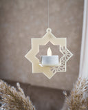 dekorativ vägg- eller ljusdekoration med islamiskt inspirerad design i beige